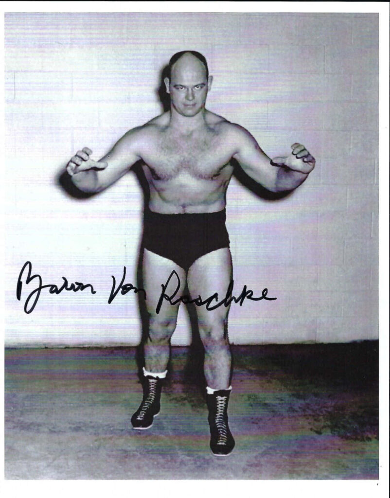 Black and white portrait of wrestler Baron Von Raschke in classic stance with intense expression Wallpaper