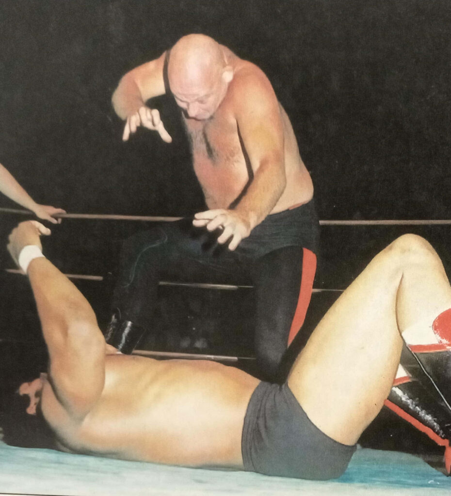 American wrestler Baron Von Raschke in intense action showcasing aggressive wrestling style wallpaper