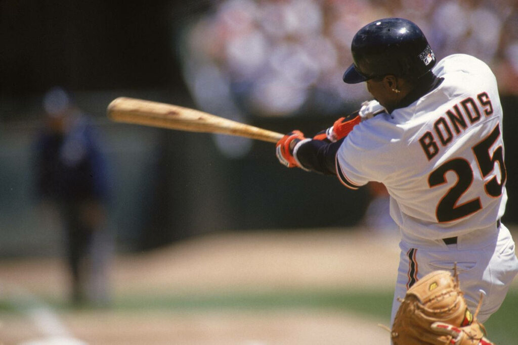 Barry Bonds swinging baseball bat in number 25 jersey dynamic energetic game action wallpaper