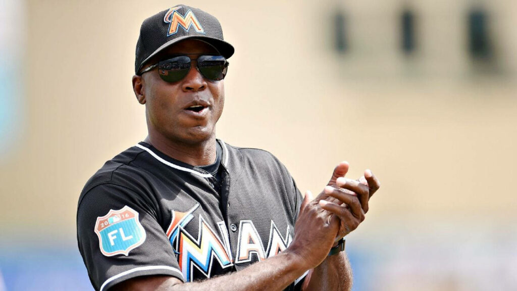 Barry Bonds cheering in Miami Marlins uniform with sunglasses vibrant baseball wallpaper background