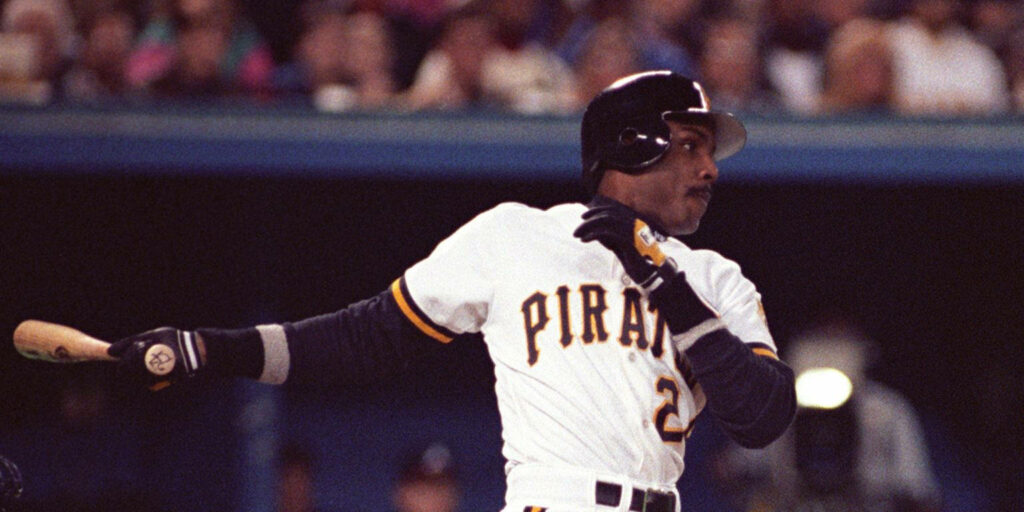 Barry Bonds mid-swing in Pittsburgh Pirates uniform baseball game wallpaper background