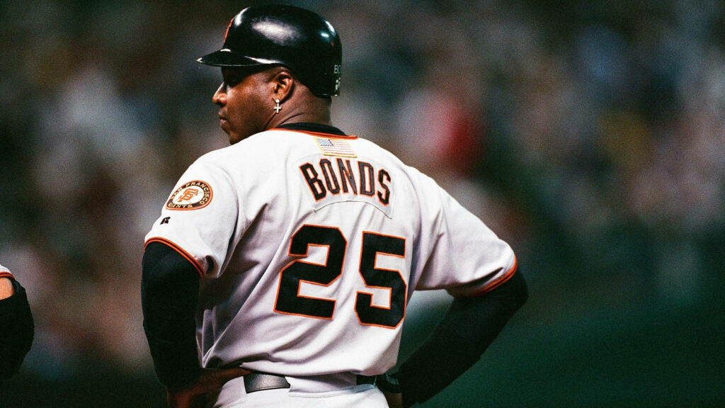 Barry Bonds in San Francisco Giants uniform number 25 standing confidently on baseball field Wallpaper
