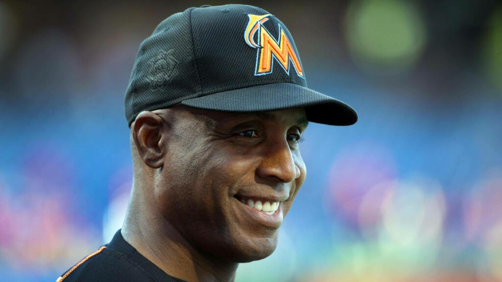 Barry Bonds smiling in black Miami Marlins cap with blurred stadium background closeup Wallpaper