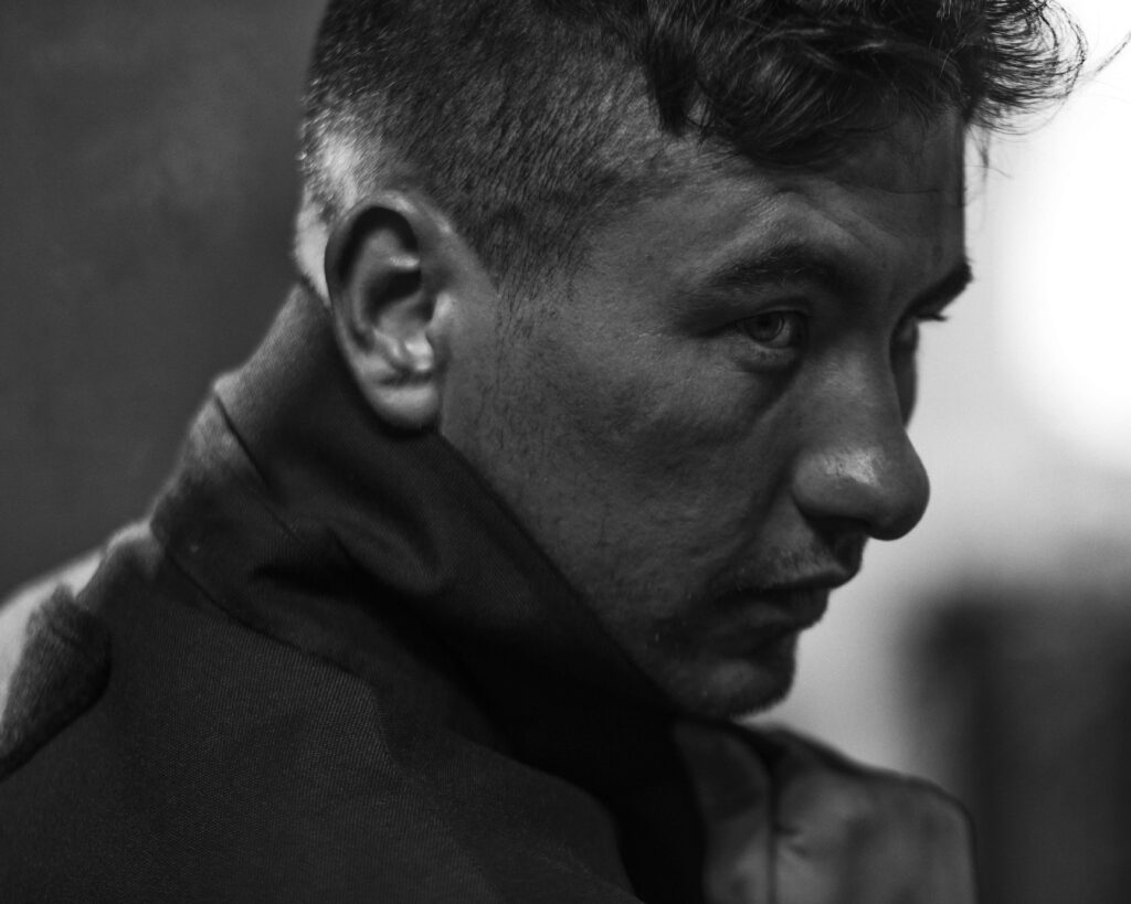 Barry Keoghan intense profile black and white wallpaper with dramatic lighting and deep emotion