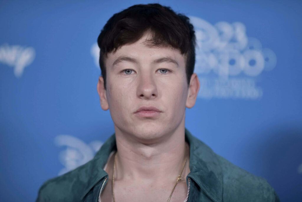 Barry Keoghan portrait wallpaper blue background calm confident actor close-up image