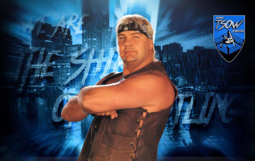 Barry Windham wrestler with arms crossed blue cityscape background strong presence wallpaper