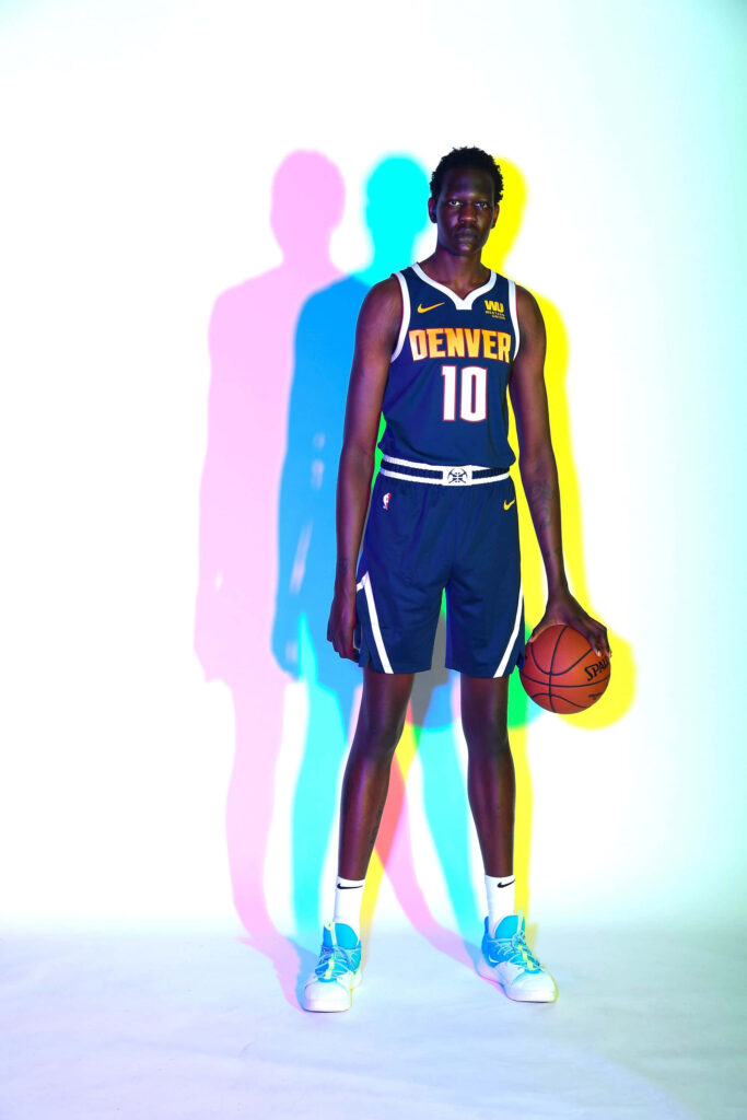 Bol Bol Denver Nuggets basketball portrait with vibrant blue pink yellow colorful shadows wallpaper