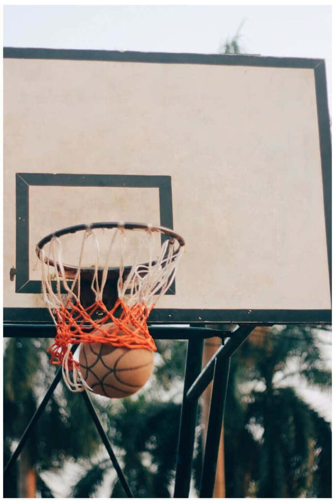 Perfect Swish: Basketball Scoring in Nature - Wallpaper Background