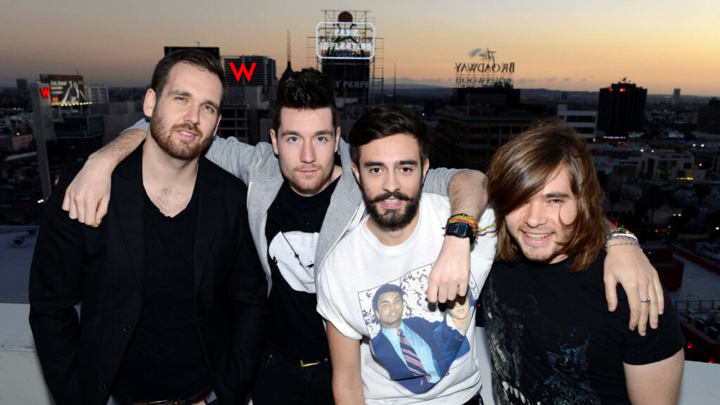Bastille band members Dan Smith Kyle Simmons Will Farquarson and Chris Wood rooftop sunset wallpaper background