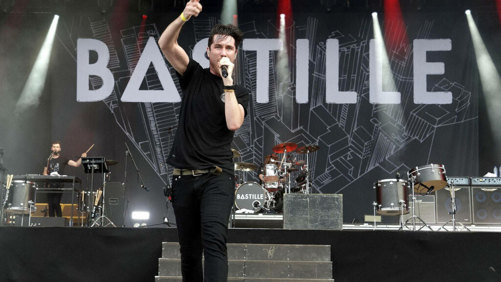 Bastille live concert energetic stage presence dynamic lighting band logo backdrop wallpaper