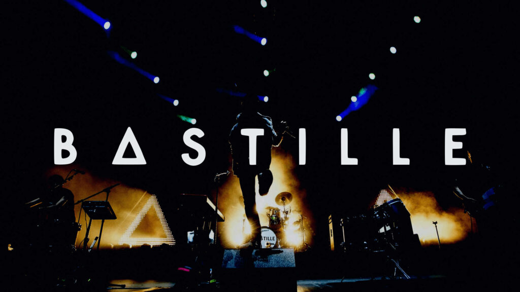 Bastille live performance wallpaper with vibrant lights and bold Bastille logo background