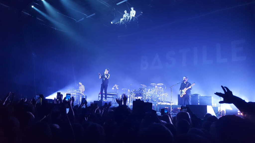 Bastille live concert London 2019 Dan Smith and band vibrant stage performance wallpaper background