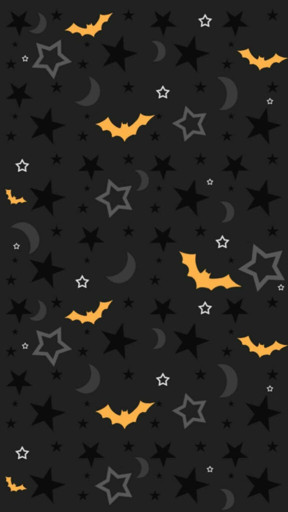 Halloween Magic: A Charming Background with Playful Orange Bats Dancing under a Starry Night Wallpaper