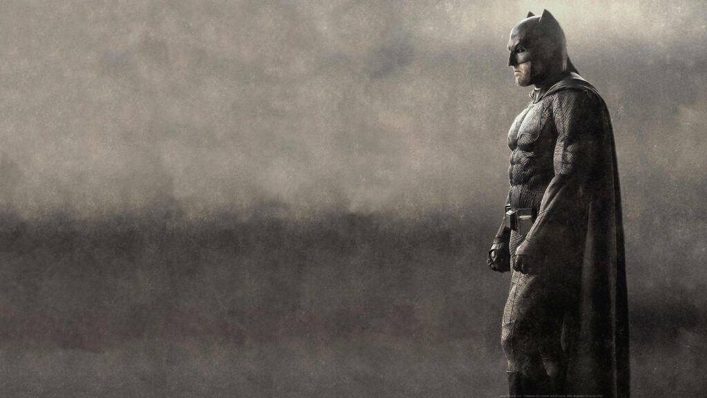 Black and white 4k Batman wallpaper showing brooding superhero in detailed suit profile view