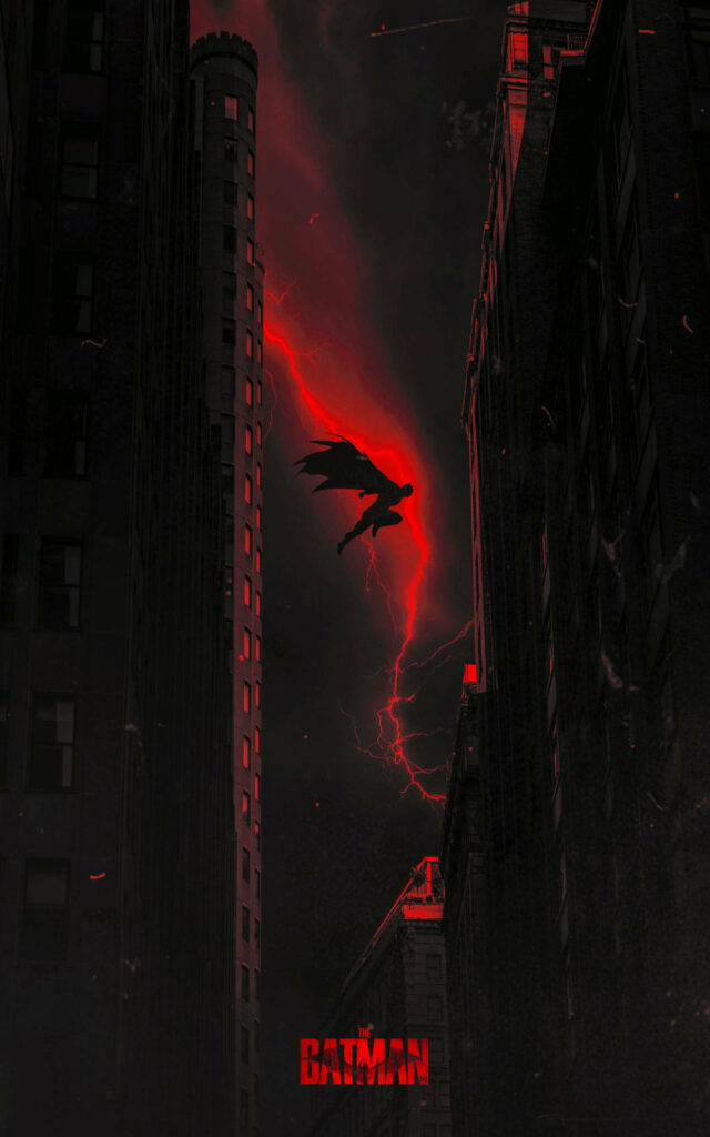 Batman Leaps Between Towers: Dramatic Red Sky Wallpaper Art