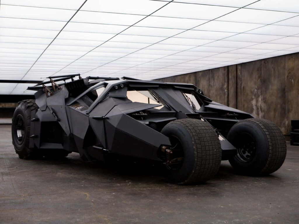 The Dark Knight's Majestic Beast: Batman's Monster Car Unleashed in a Sleek Underground Lair Wallpaper