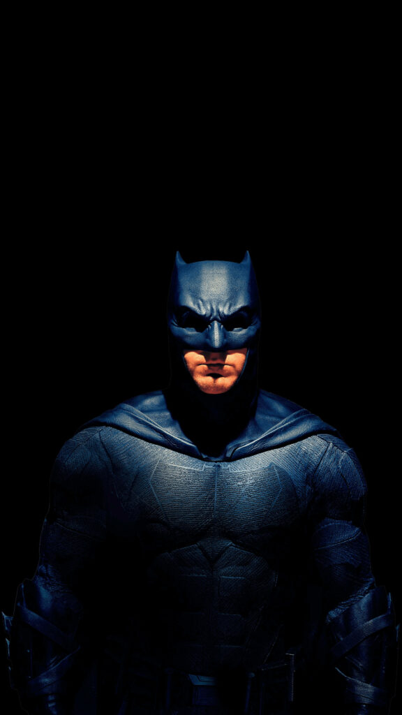 Batman stands strong with neutral expression against dark background 4k superhero wallpaper
