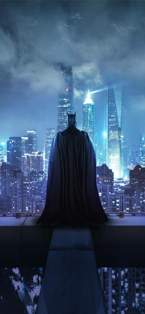 Batman Vigilantly Overlooks Arkham City's Neon Skyline at Night Wallpaper