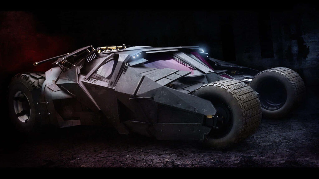 Batman's Legendary Monster Car: Unleashed Power on Cracked Terrain Wallpaper