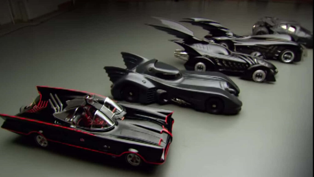 Batmobile Evolution: A Stunning Display of Batman's Wheels on the Prowl Wallpaper