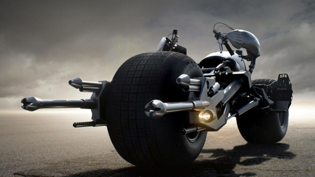 The Batmobile Motorcycle: Roaming Alone on the Desolate Road Amidst the Brooding Sky Wallpaper