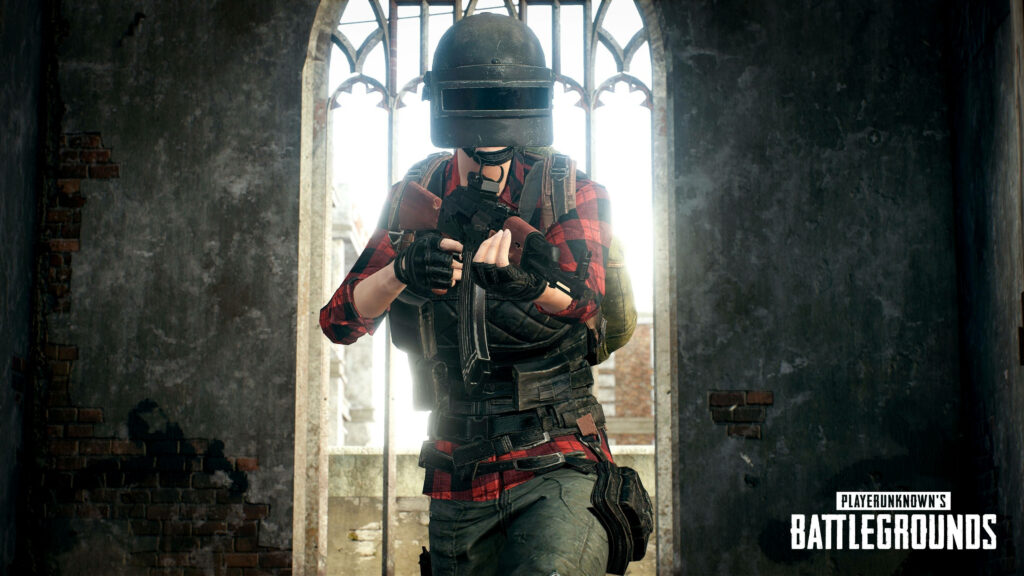 Surviving the Desolation: Pubg Lite Mobile Player Takes Aim in Abandoned Shelter Wallpaper