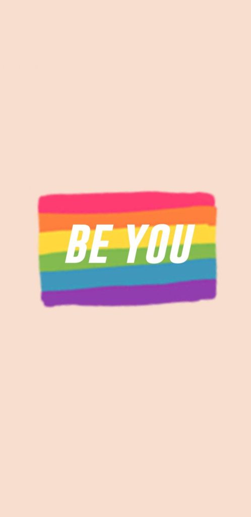 LGBT rainbow flag wallpaper with BE YOU text on soft beige background vibrant and uplifting design