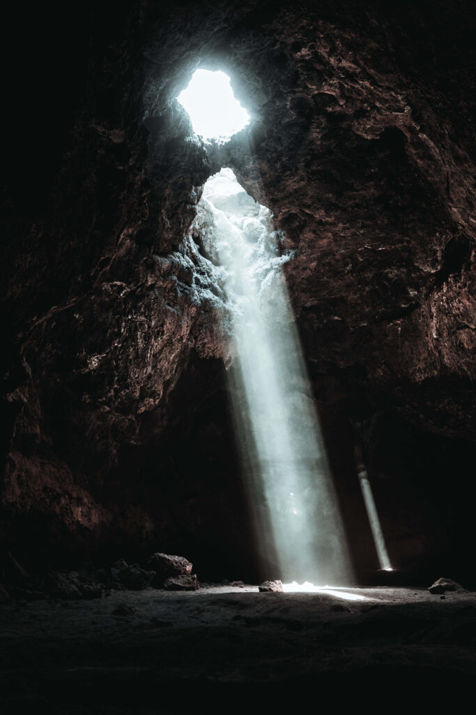 Stunning Beach Cave Wallpaper with Light and Dramatic Shadows