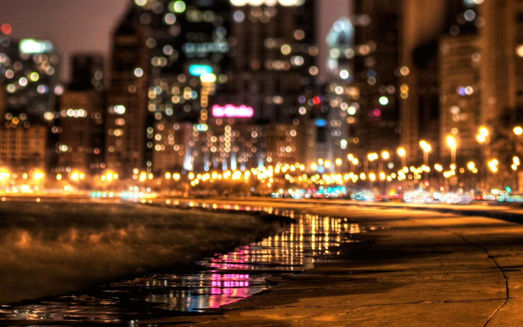 Walking in Serenity: A Beachside Stroll Beneath Glowing Street Lights Wallpaper