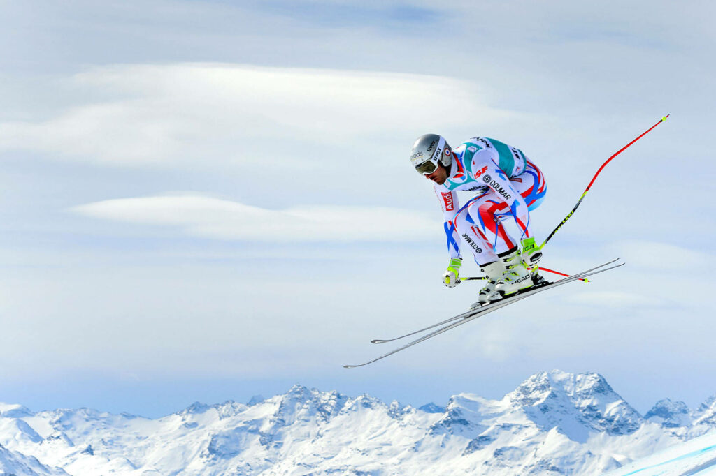Beat Feuz Alpine Skiing Jump Wallpaper - Stunning Mountain Vista