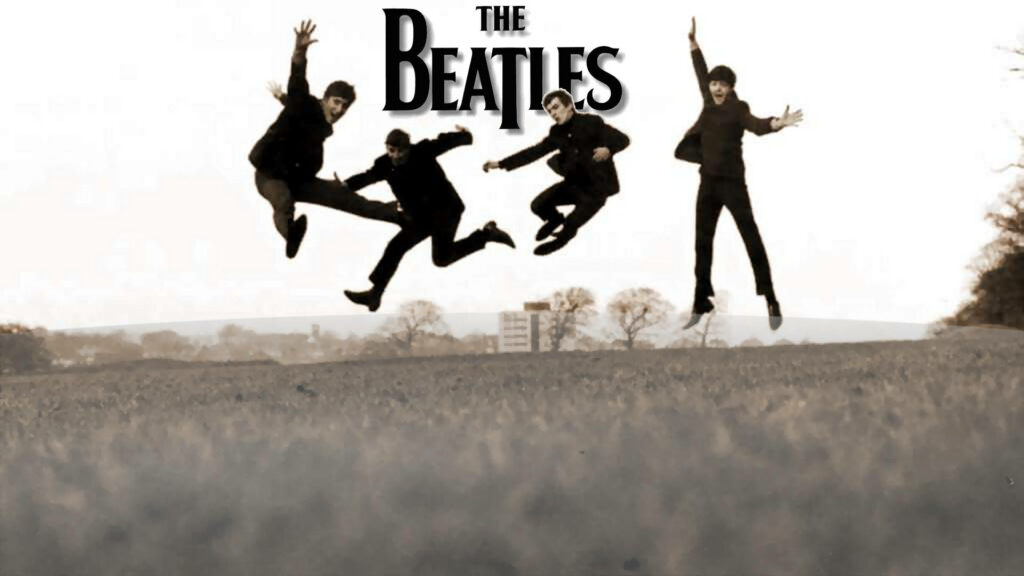 Iconic Beatles Mid-Air Wallpaper: Energetic Style & Serene Background