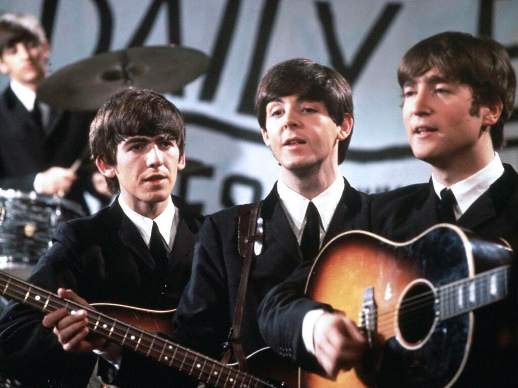 Beatles Wallpaper: Iconic Band Performing with Timeless Charm