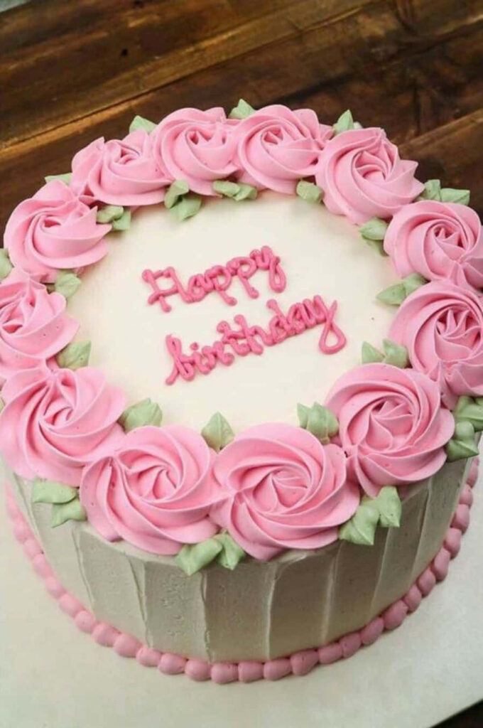 Elegant Pink Rose Birthday Cake Wallpaper on White Frosted Background