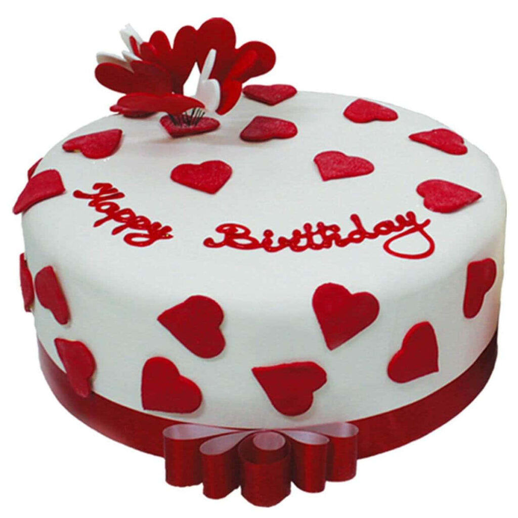 Elegant Birthday Cake with Heart Designs and White Icing Background Wallpaper