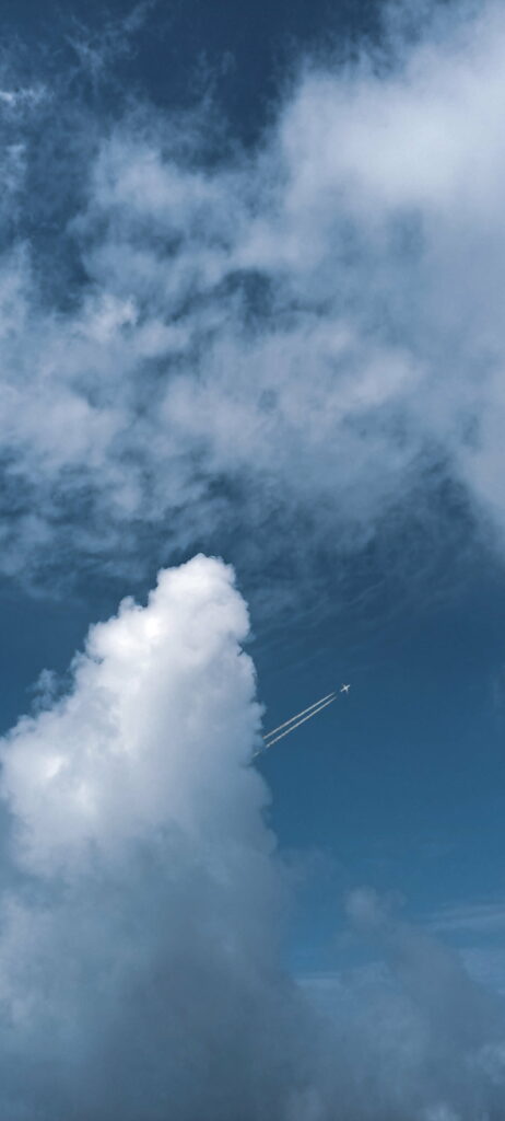 Serene HD Wallpaper: Blue Sky, Fluffy Clouds & Airplane Contrail