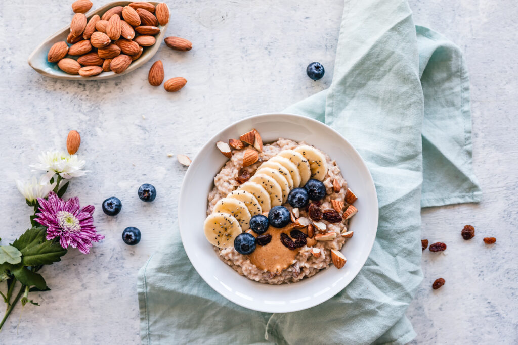 Elegant Breakfast Bowl Wallpaper: Oatmeal, Fruit & Flowers Design