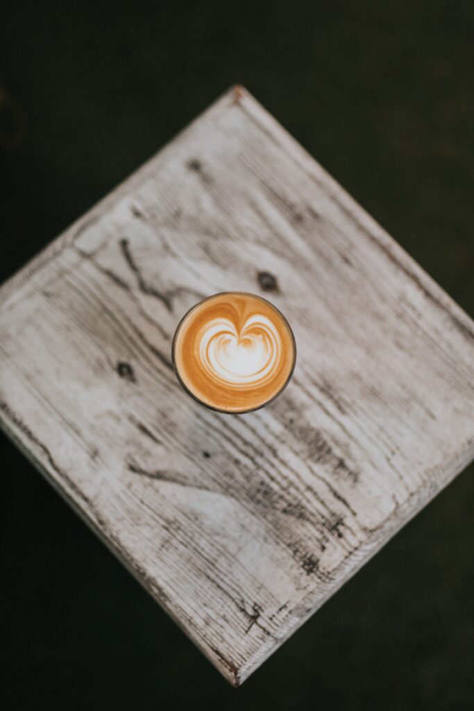 Stunning Cappuccino Latte Art on Rustic Wood - Wallpaper Background