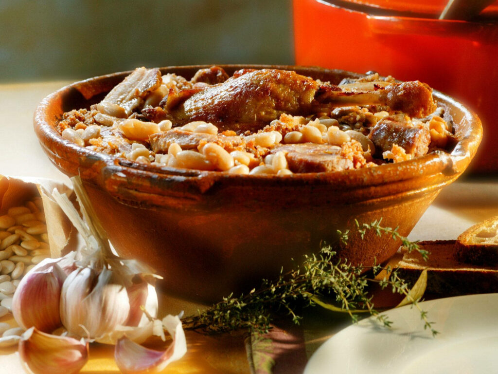 Rustic French Cassoulet Wallpaper: Hearty Dish with Fresh Herbs & Spices