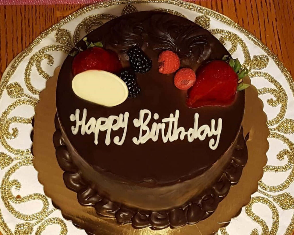 Elegant Chocolate Cake Wallpaper with Berries & Happy Birthday Message