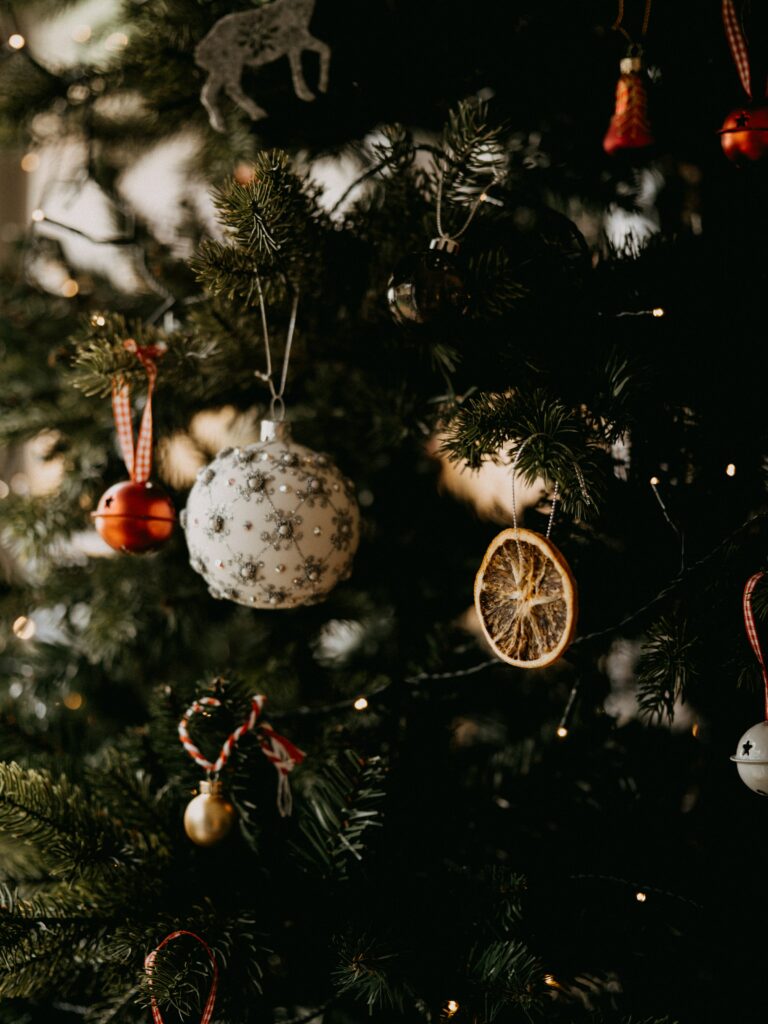 Beautifully Decorated Christmas Tree Wallpaper with Festive Accents