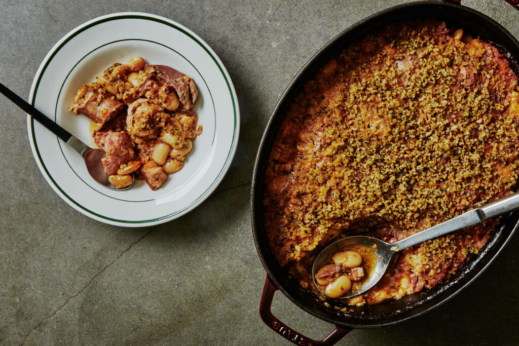Elegant Cassoulet Flat Lay: Hearty French Dish with Golden Topping Wallpaper