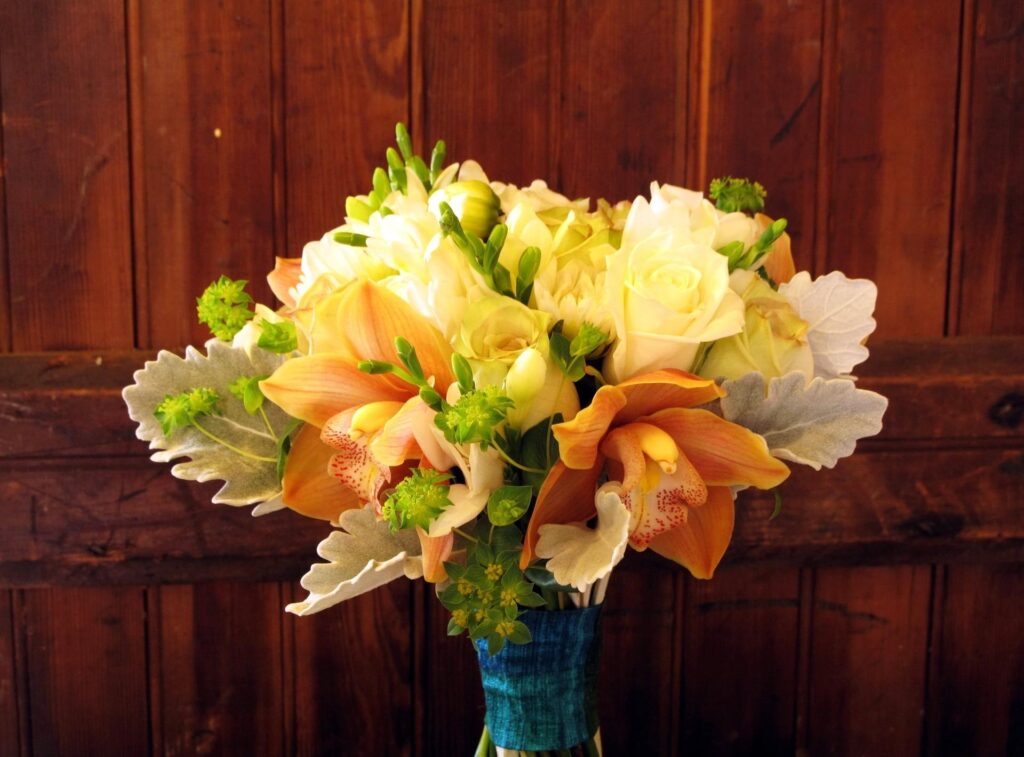 Charming Floral Bouquet on Rustic Wood - Perfect Wallpaper Background