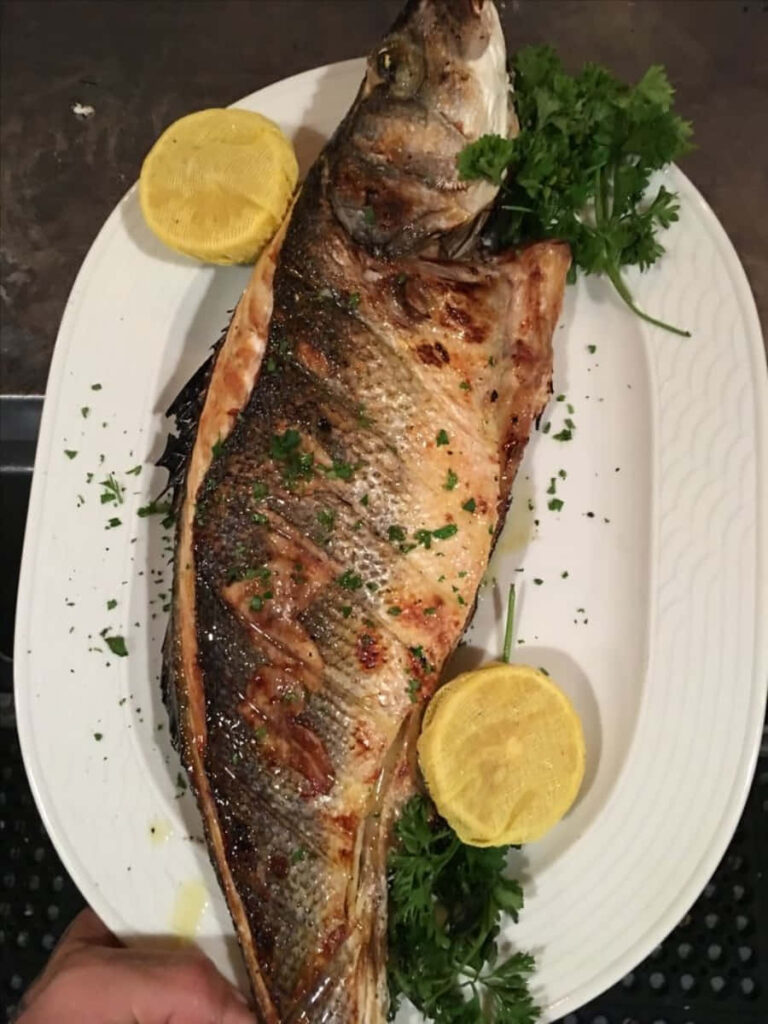 Stunning Grilled Whole Fish on White Plate with Parsley & Lemon Wallpaper