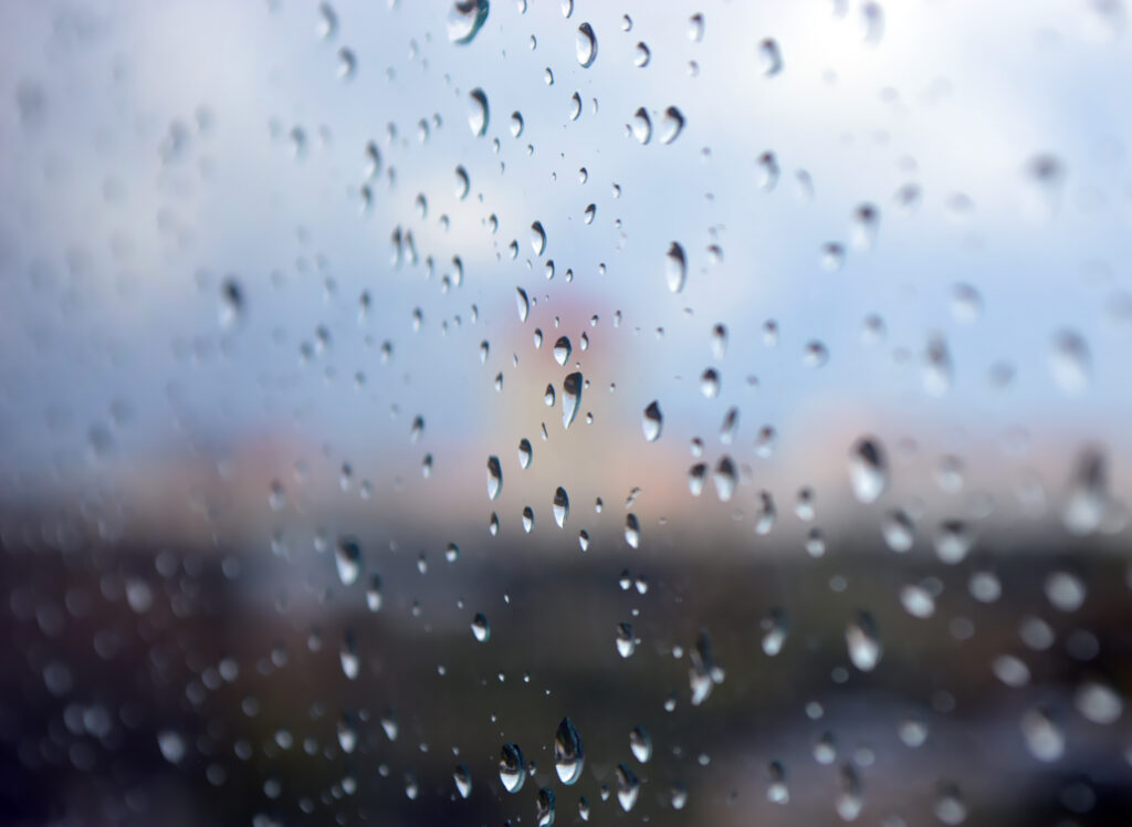 Stunning Macro Raindrops on Glass: Soothing Wallpaper Background