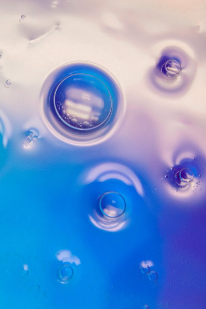 Dreamy Macro Wallpaper: Bubbles on Soft Blue & Purple Liquid Background