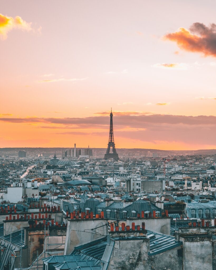 Paris Sunset Wallpaper: Eiffel Tower Against a Vibrant Sky