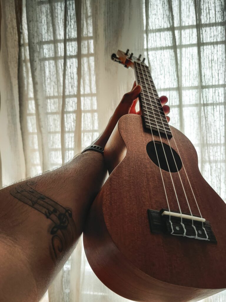 Elegant Ukulele Wallpaper: Captivating Light & Texture Background