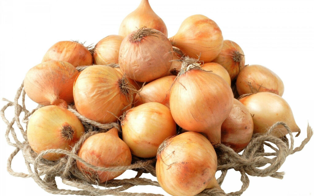 Golden Yellow Onions on Jute: Organic Wallpaper Background