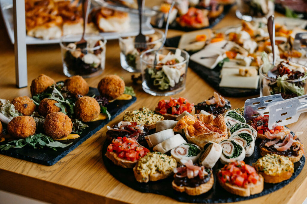Elegant Appetizer Spread on Wooden Table - Perfect Buffet Wallpaper