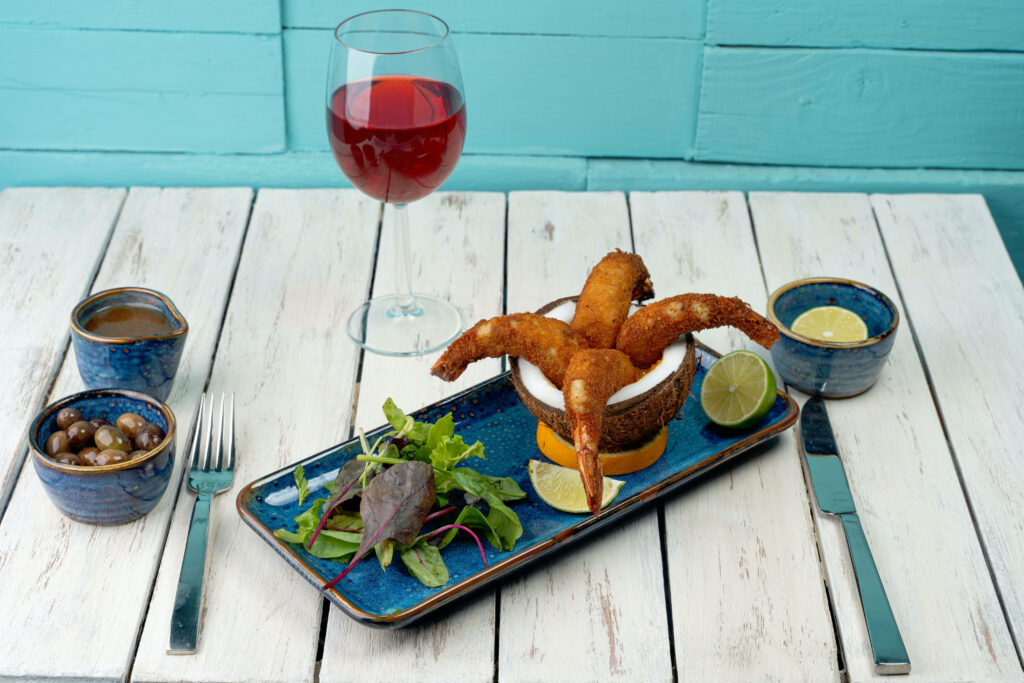 Crispy Prawns in Coconut Shell - Creative Plating & Fresh Greens Wallpaper